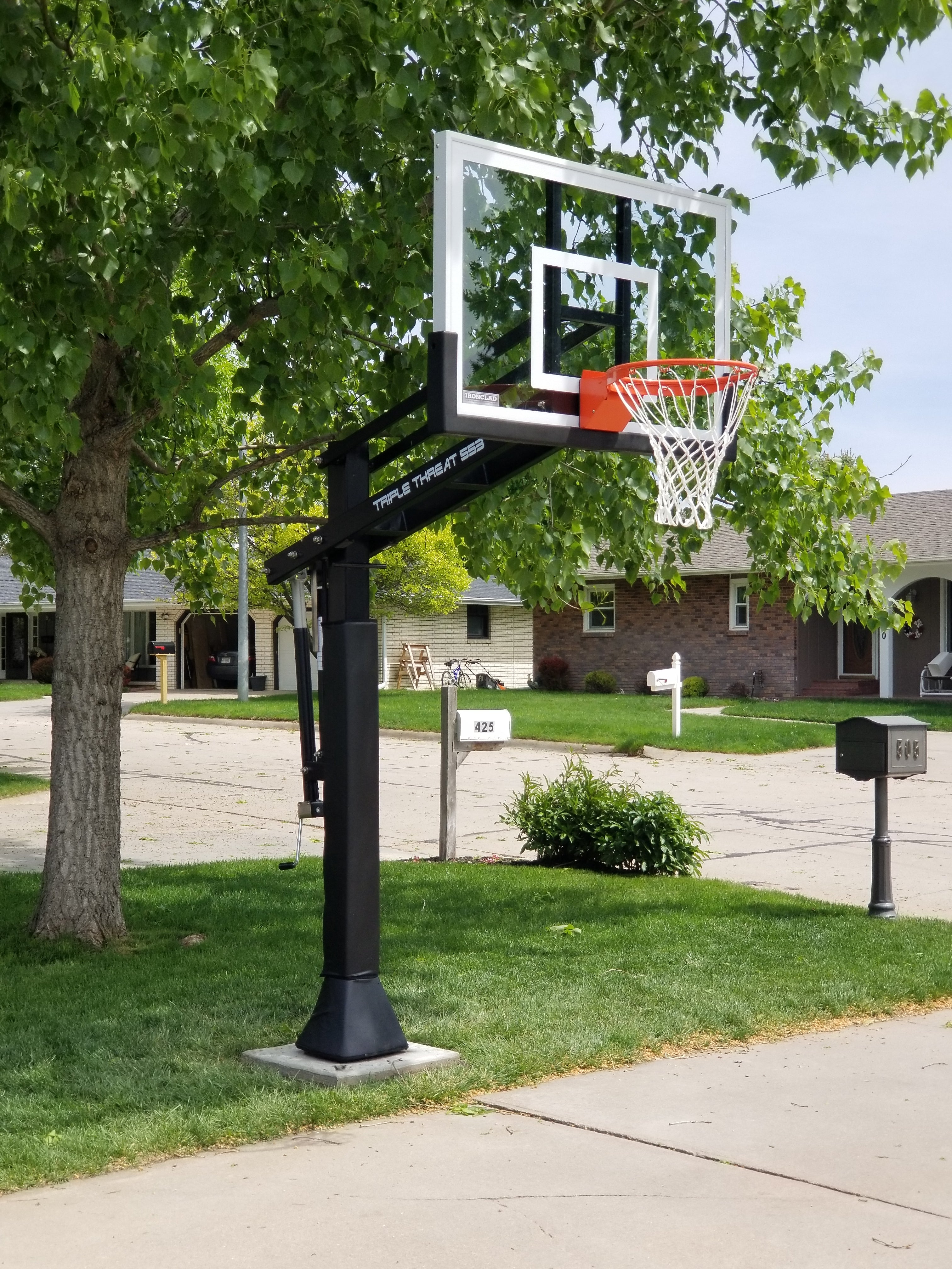 Ironclad TPT553-MD Adjustable In-Ground Basketball Hoop – 54" Glass Backboard, Heavy-Duty Post, Lifetime Warranty